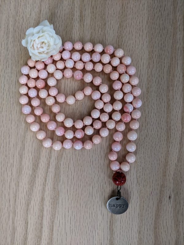 Queen Conch Shell with carved Coral Mala